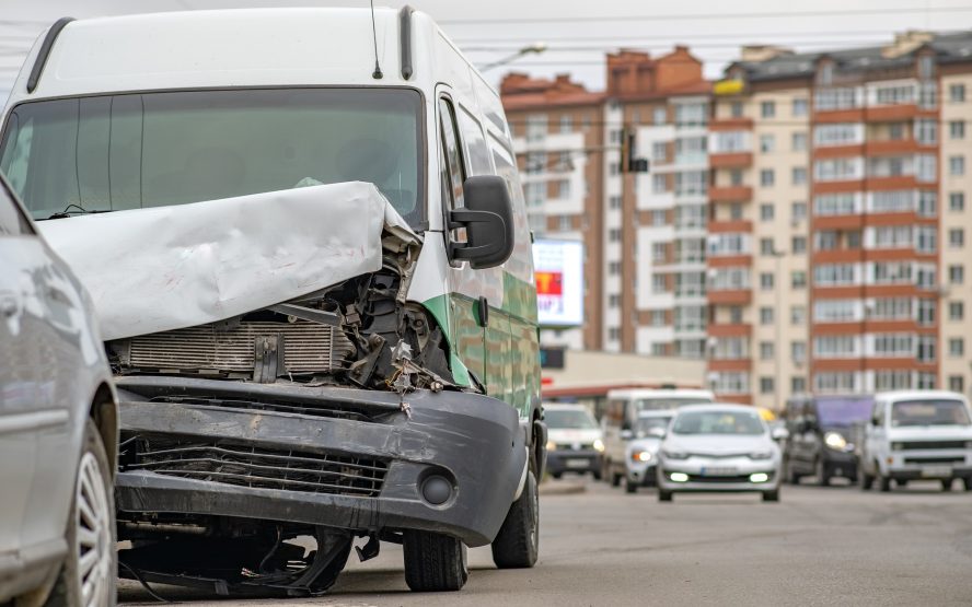 Heavily damaged car after car crash accident on a city street