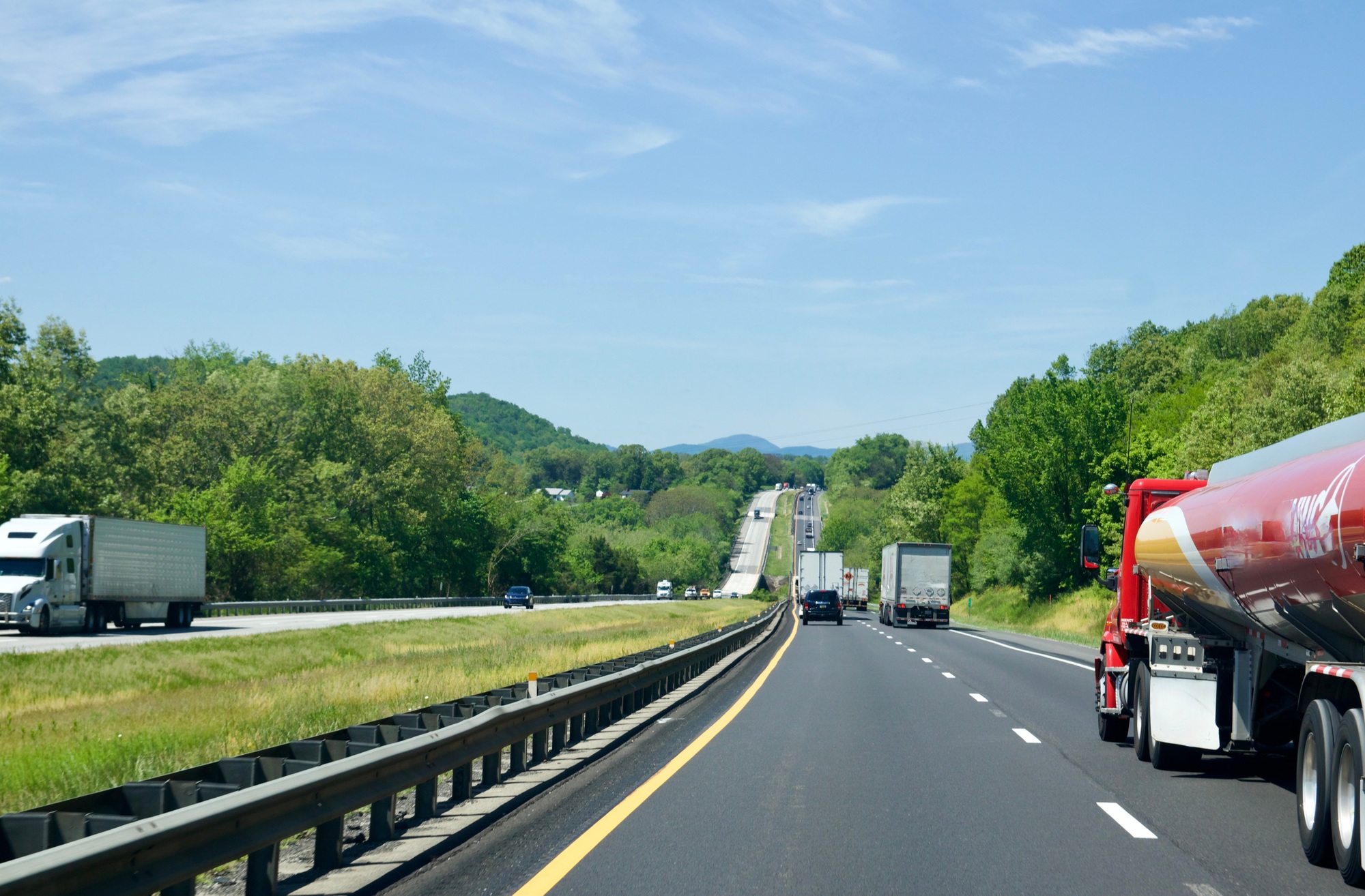 Big 18 wheeler trucks on country highway