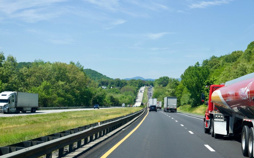 Big 18 wheeler trucks on country highway